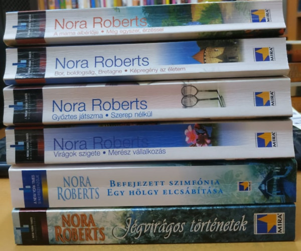 Nora Roberts - 6 db Nora Roberts: A mama albrlje + Gyztes jtszma + Virgok szigete + Befejezett szimfnia + Bor, boldogsg, Bretagne + Jgvirgos trtnetek